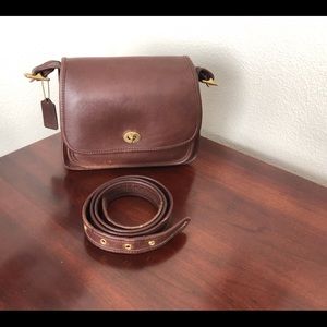 Coach VTG Rambler # L8E-9061 Brown/Brass. Hang tag. Minor color rub off only.